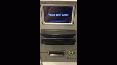 Person Pushing Button on ATM