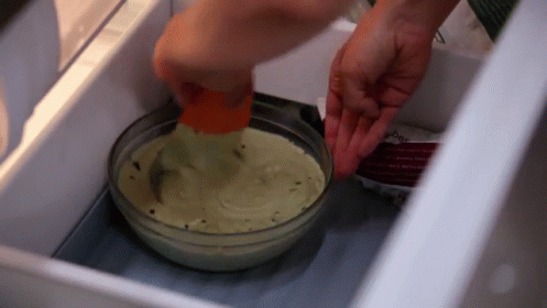 Person Putting Food In Refrigerator GIF