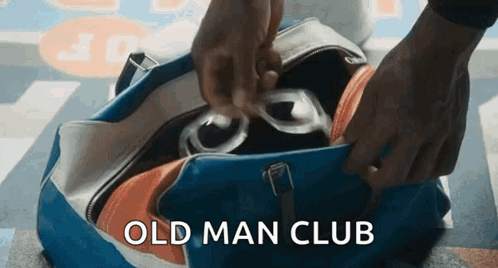 Person Putting Glasses In Old Man Club Bag GIF