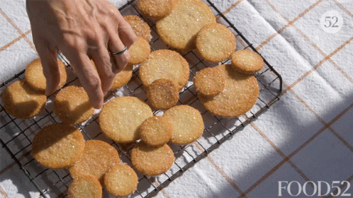 Person Reaching for Cookie on Wire Rack food52