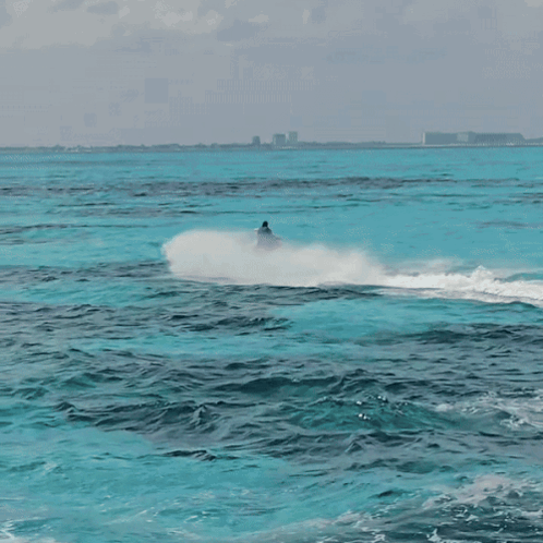 Person Riding Jet Ski GIF