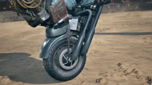 Person Riding Motorcycle In Sand With California Bag GIF