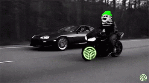 Person Riding Motorcycle Next To Car On Highway GIF