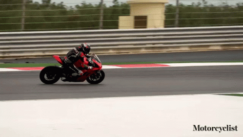 Person Riding Motorcycle on Track Saying Motorcyclist