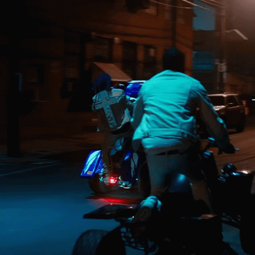Person Riding Motorcycle With Cross On Back GIF