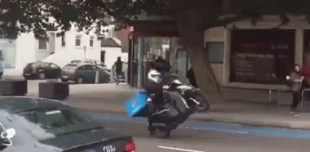 Person Riding Motorcycle With Domino's Pizza Bag GIF