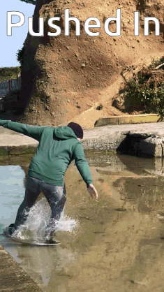 Person Riding Skateboard in Puddle