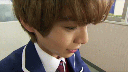 Person's Face Close Up in Blue Suit
