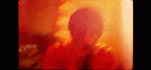 Person's Face Close Up Red Yellow Background