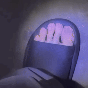 Person's Feet in Purple Chair