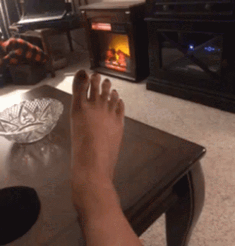 Person's Foot on Coffee Table