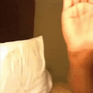 Person's Hand Next to Diaper