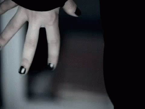 Person's Hand With Black Nail Polish GIF