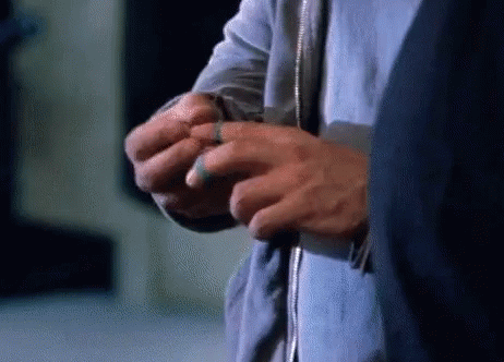 Person's Hands With Blue Ring GIF