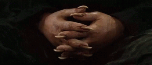 Person's Hands With Long Claws GIF