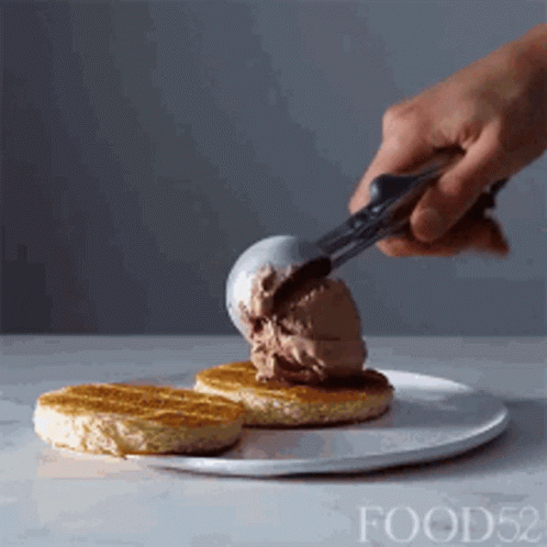 Person Scooping Ice Cream Onto Waffle GIF
