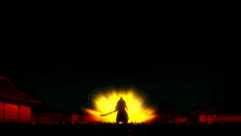 Person Silhouette in Front of Fire