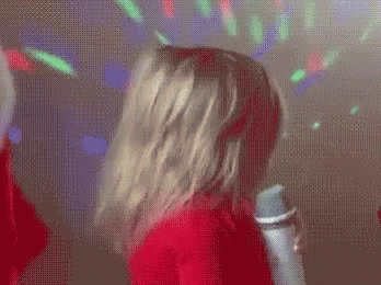 Person Singing in Santa Costume