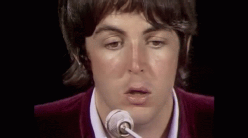 Person Singing Into Microphone