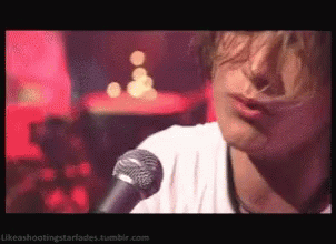 Person Singing Into Microphone Likeashootingstarfades