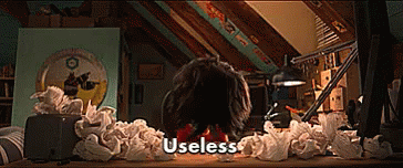 Person Sitting At Desk With Crumpled Paper And Useless GIF