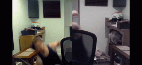 Person Sitting In Chair In Room GIF