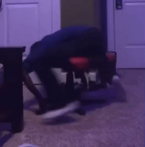 Person Sitting in Dark Room