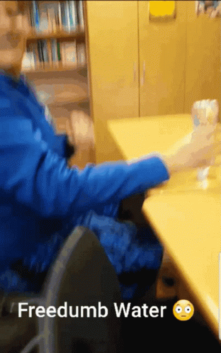 Person Sitting With Water Bottle Freedumb Water