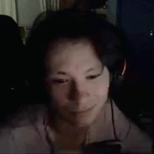 Person Smiling Wearing Headphones