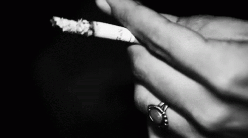 Person Smoking Cigarette With Ring GIF