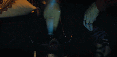 Person Smoking Hookah With Blue Smoke