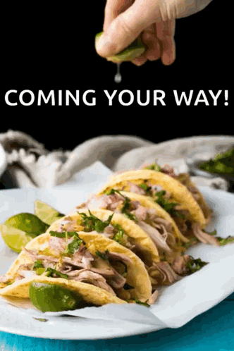 Person Squeezing Lime Over Tacos