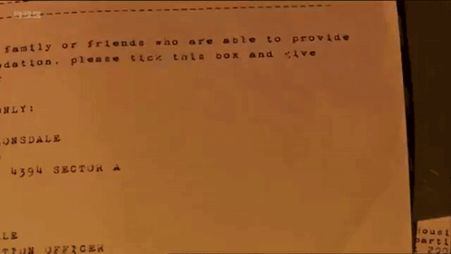 Person Stamping Paper Saying Leeds