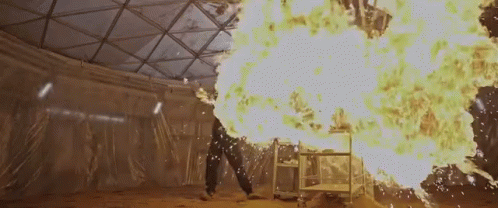 Person Standing Before Fireball