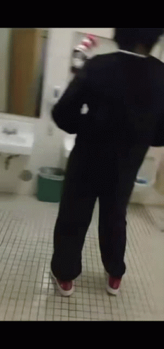Person Standing In Bathroom GIF