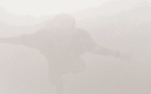 Person Standing in Clouds Feet in Air