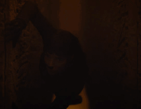 Person Standing in Dark Room