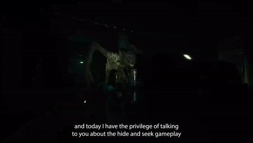 Person Standing in Dark Room With Monster