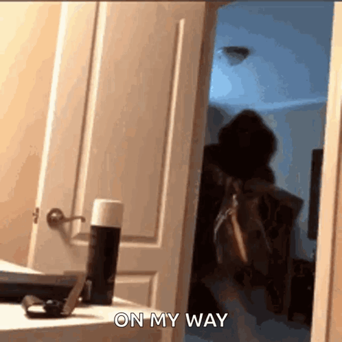 Person Standing In Doorway Saying On My Way GIF