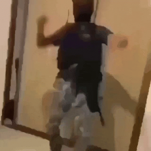 Person Standing in Doorway With Backpack
