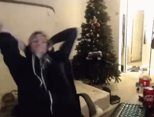 Person Standing in Front of Christmas Tree