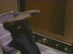 Person Standing in Front of Microwave