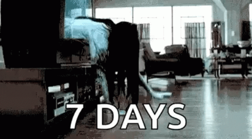 Person Standing In Living Room Saying 7 Days GIF