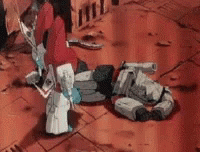 Person Standing Next to Robot Lying on Floor