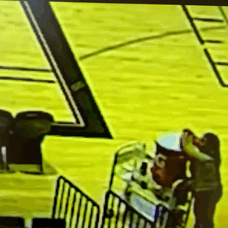 Person Standing on Basketball Court