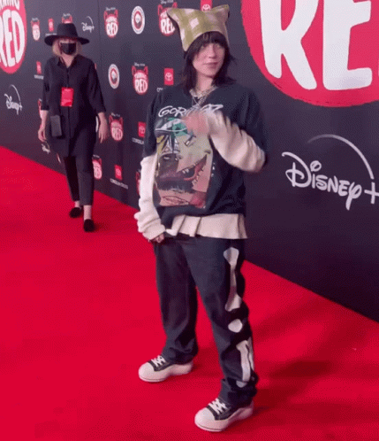 Person Standing on Disney Plus Red Carpet