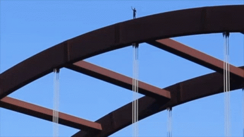 Person Standing On Top Of Bridge GIF