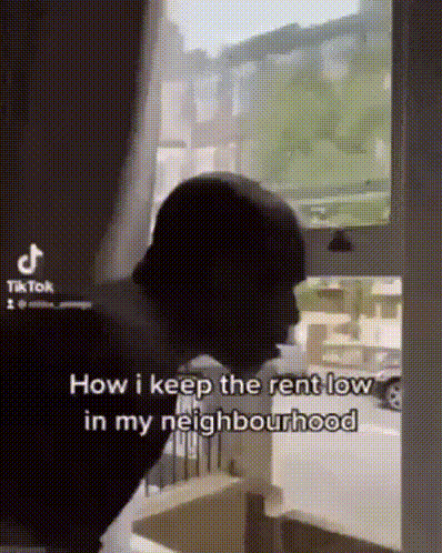 Person Standing With Head In Hands GIF