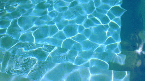 Person Swimming in Blue Pool