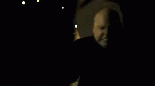 Person Taking Selfie in Darkness